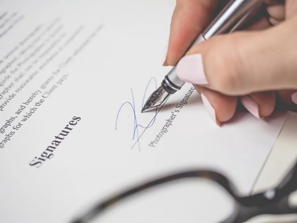 Signing off a document with a fountain pen